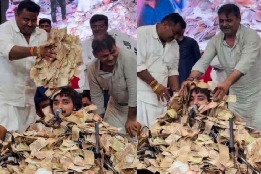 টাকার পাহাড়ে চাপা পড়েও থামেননি গায়ক, ভিডিও ভাইরাল